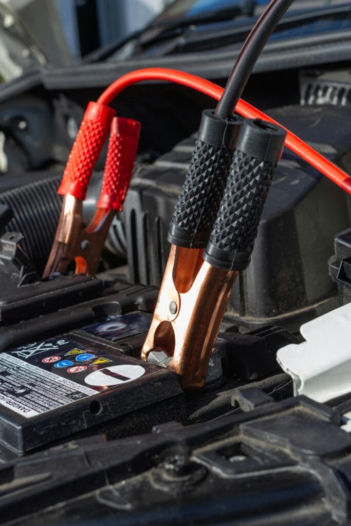 jumper cables on charging battery